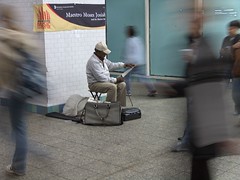 Guy playing a saw in subway
